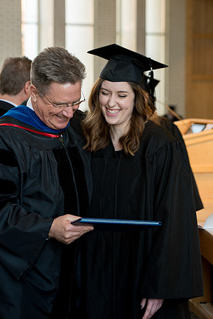BYU-Idaho students graduate from College of Eduation and Human Development convocation receive their diplomas.