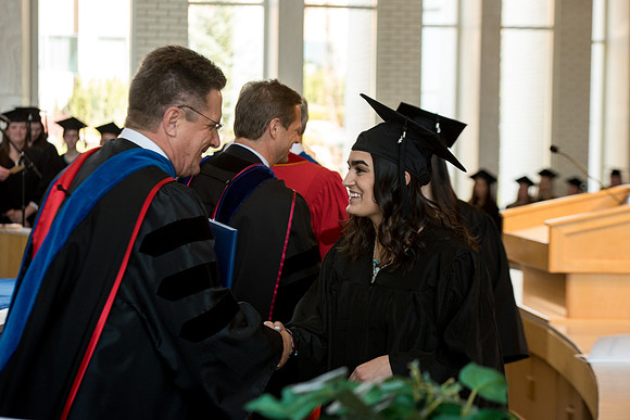 BYU-Idaho students graduate from College of Eduation and Human Development convocation receive their diplomas.