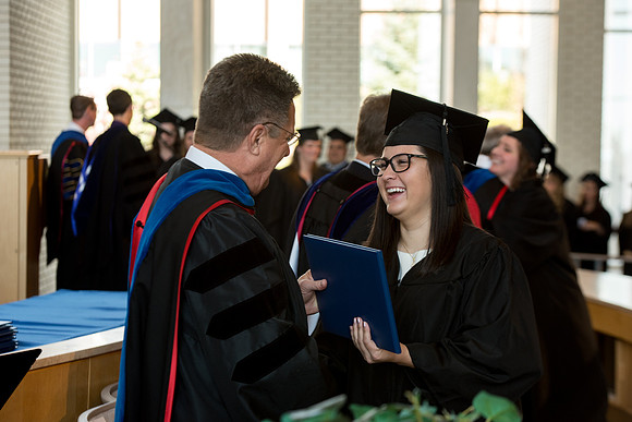 BYU-Idaho students graduate from College of Eduation and Human Development convocation receive their diplomas.