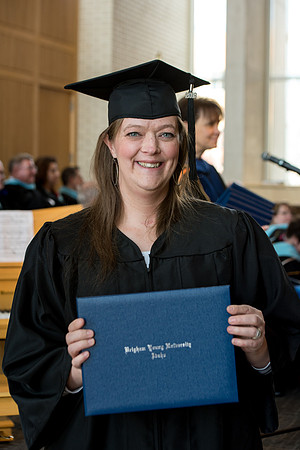BYU-Idaho students graduate from College of Eduation and Human Development convocation receive their diplomas.