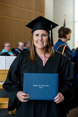 BYU-Idaho students graduate from College of Eduation and Human Development convocation receive their diplomas.