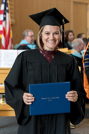 BYU-Idaho students graduate from College of Eduation and Human Development convocation receive their diplomas.