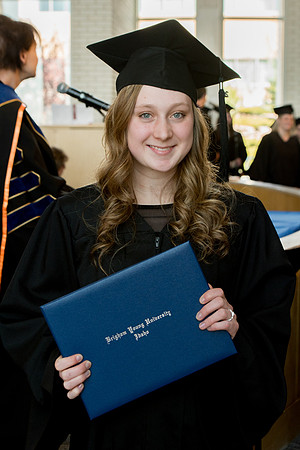 BYU-Idaho students graduate from College of Eduation and Human Development convocation receive their diplomas.