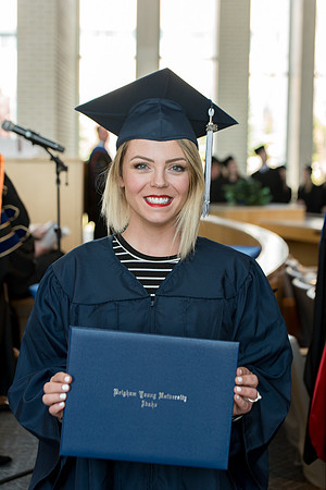 BYU-Idaho students graduate from College of Eduation and Human Development convocation receive their diplomas.
