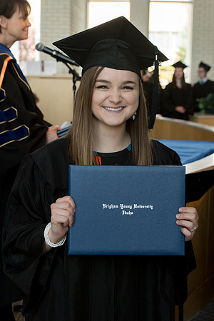 BYU-Idaho students graduate from College of Eduation and Human Development convocation receive their diplomas.
