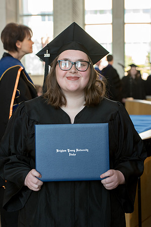 BYU-Idaho students graduate from College of Eduation and Human Development convocation receive their diplomas.