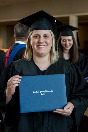 BYU-Idaho students graduate from College of Eduation and Human Development convocation receive their diplomas.
