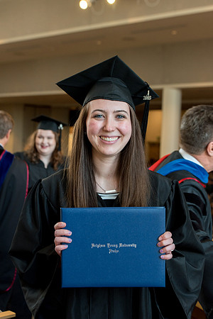 BYU-Idaho students graduate from College of Eduation and Human Development convocation receive their diplomas.