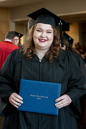 BYU-Idaho students graduate from College of Eduation and Human Development convocation receive their diplomas.