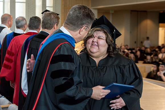 BYU-Idaho students graduate from College of Eduation and Human Development convocation receive their diplomas.