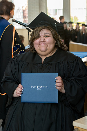 BYU-Idaho students graduate from College of Eduation and Human Development convocation receive their diplomas.