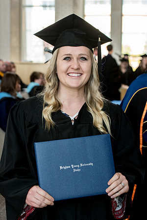 BYU-Idaho students graduate from College of Eduation and Human Development convocation receive their diplomas.