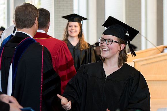 BYU-Idaho students graduate from College of Eduation and Human Development convocation receive their diplomas.