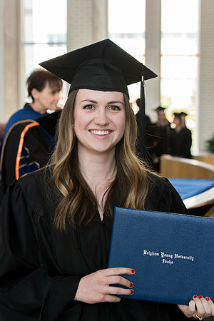 BYU-Idaho students graduate from College of Eduation and Human Development convocation receive their diplomas.