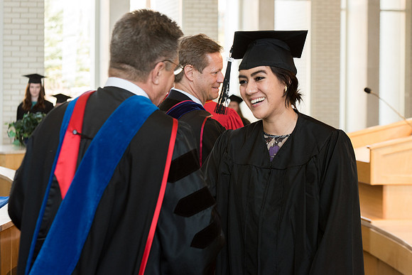 BYU-Idaho students graduate from College of Eduation and Human Development convocation receive their diplomas.
