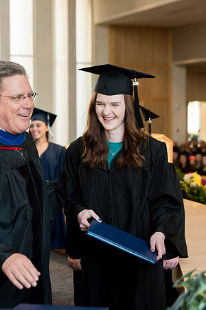 BYU-Idaho students graduate from College of Eduation and Human Development convocation receive their diplomas.