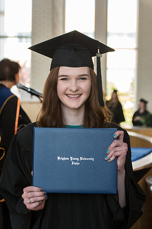 BYU-Idaho students graduate from College of Eduation and Human Development convocation receive their diplomas.