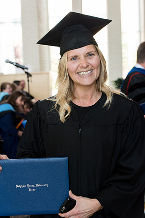 BYU-Idaho students graduate from College of Eduation and Human Development convocation receive their diplomas.