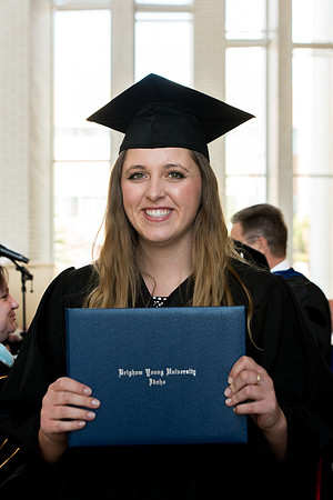 BYU-Idaho students graduate from College of Eduation and Human Development convocation receive their diplomas.