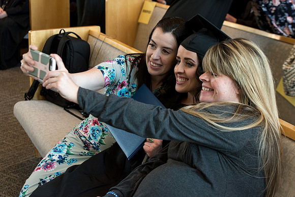 BYU-Idaho students graduate from College of Eduation and Human Development convocation receive their diplomas.