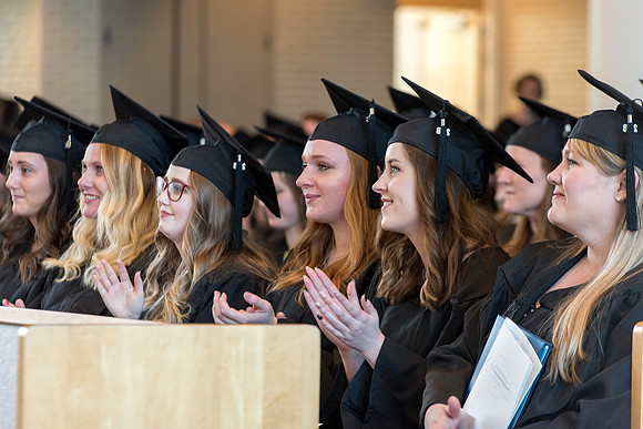 BYU-Idaho students graduate from College of Eduation and Human Development convocation receive their diplomas.