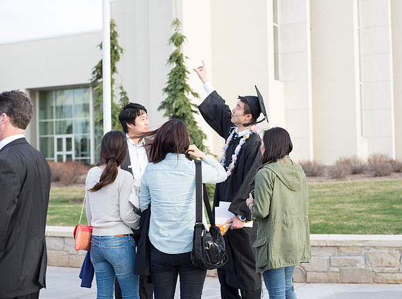 Graduates and family enjoy time between Commencement and Convocation.