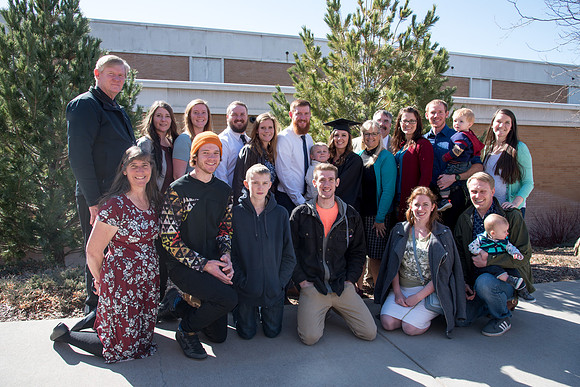 BYU-Idaho graduates with their family on campus.