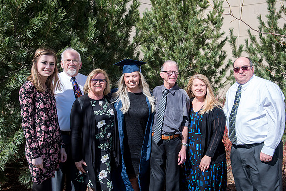 BYU-Idaho graduates with their family on campus.