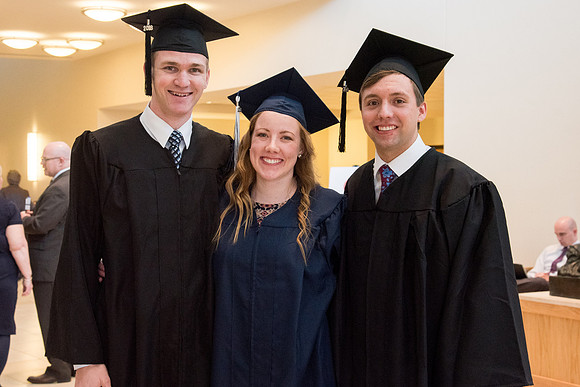 BYU-Idaho graduates with their family on campus.