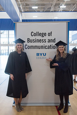 BYU-Idaho graduates with their family on campus.