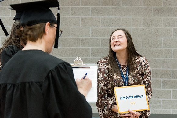 Graduates meet in the I-Center Courts for Processional.