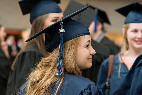 Graduates meet in the I-Center Courts for Processional.