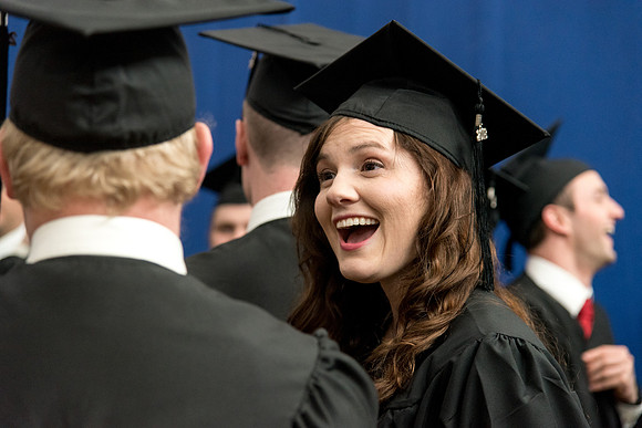 Graduates meet in the I-Center Courts for Processional.