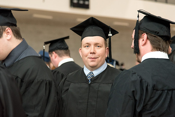 Graduates meet in the I-Center Courts for Processional.