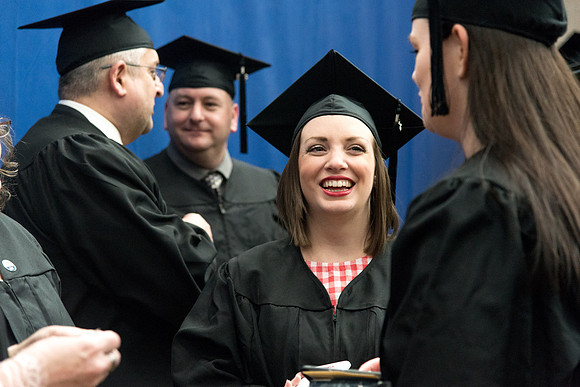 Graduates meet in the I-Center Courts for Processional.