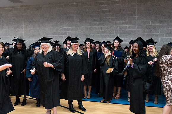 Graduates meet in the I-Center Courts for Processional.