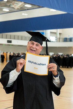 Graduates meet in the I-Center Courts for Processional.