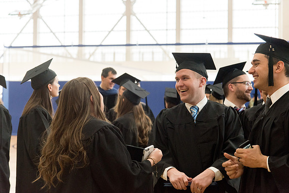 Graduates meet in the I-Center Courts for Processional.