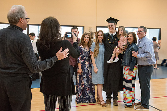 BYU-Idaho graduates with their family after the commencement service.