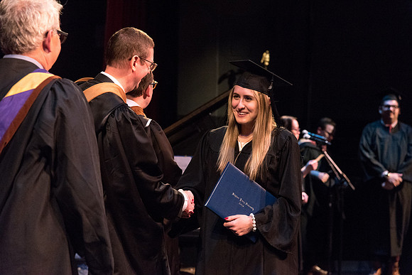 BYU-Idaho graduates from the College of Performaing and Visual Arts convocation receive their diplomas.