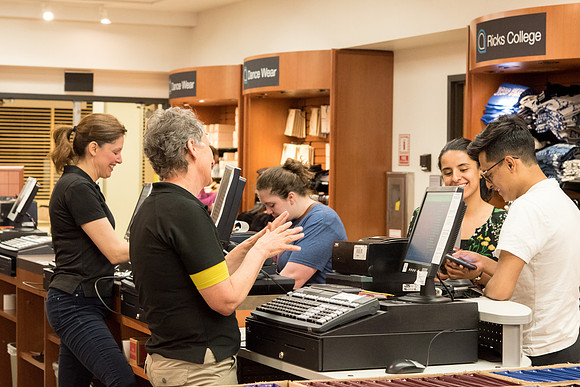 Students buying textbook at the University Store.