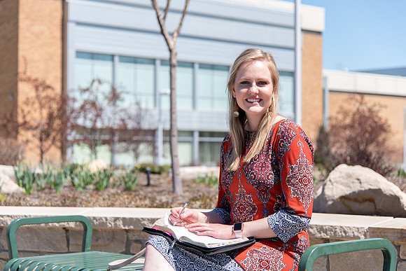Carlie Webster, sophomore, reading her scripture on campus.