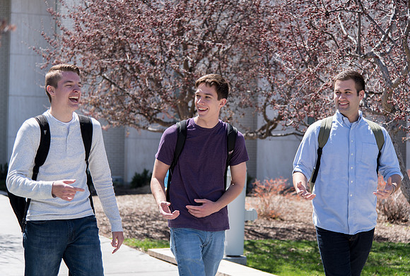 Students walking out from Taylor building after a class.