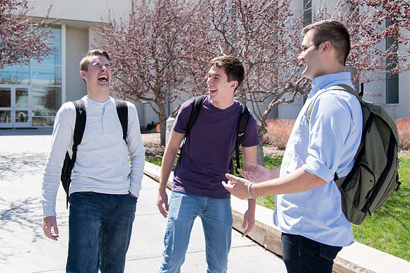 Students walking out from Taylor building after a class.