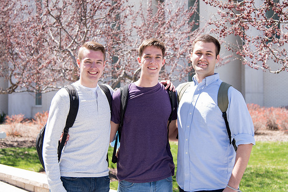 Students walking out from Taylor building after a class.