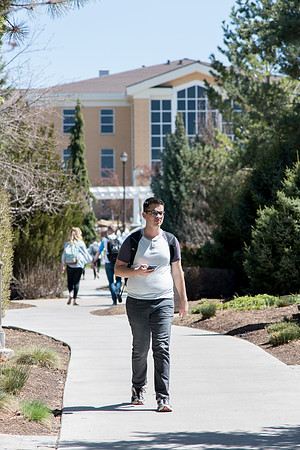 Student walking on campus.
