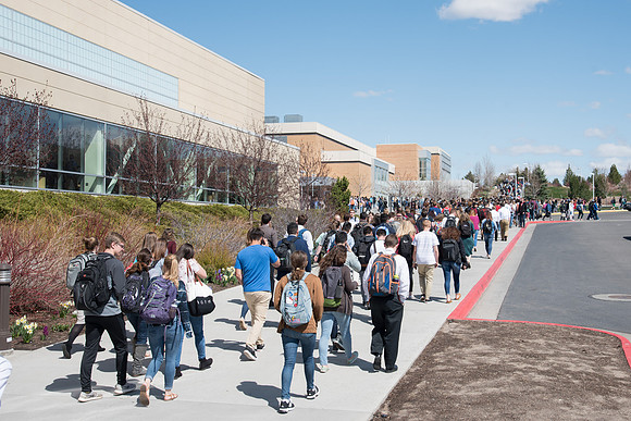 Students crowd after the devotional at the first day of Spring semester.