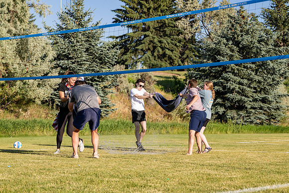 Students gather at the upper field for various 4th of July activities.