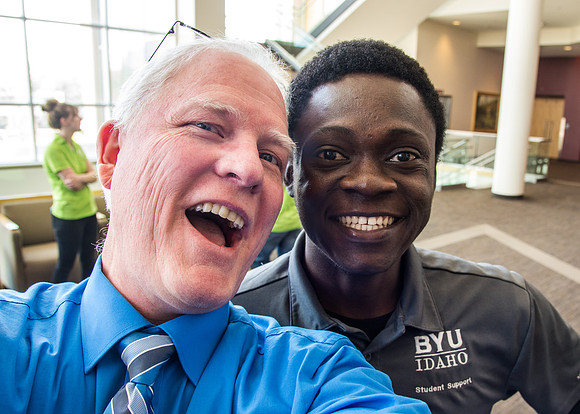 Photographer Mike Lewis with his good friend Omar Fall.