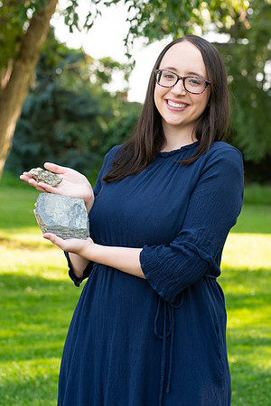 Rachel Tullis, an interdisciplinary science major, studying geology and biology. Rachel with some of her favorite rocks with fossils. Photo for LDS Philanthropies.